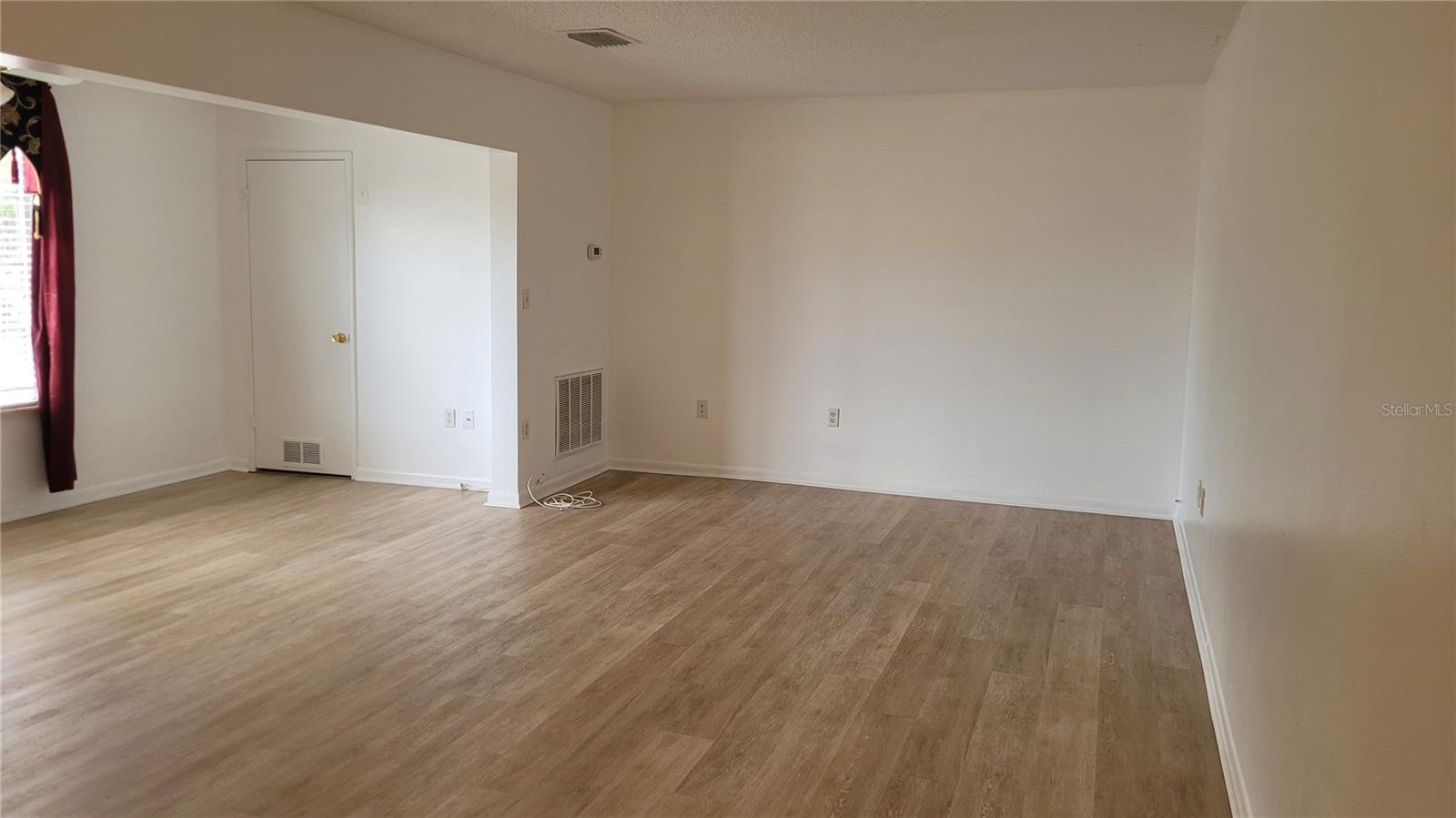 Spacious living room with luxury plank vinyl floors