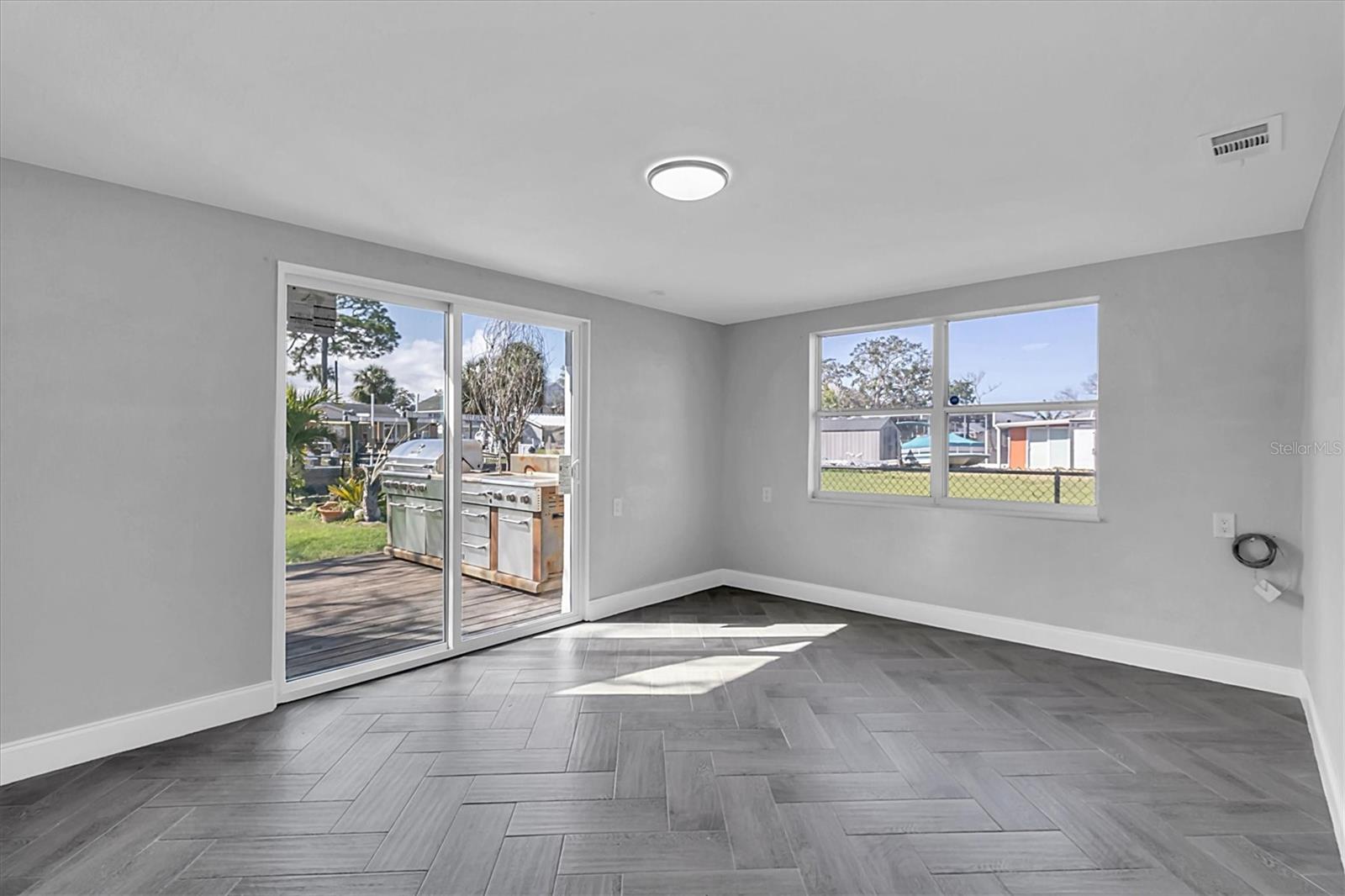 Living area with access to the patio