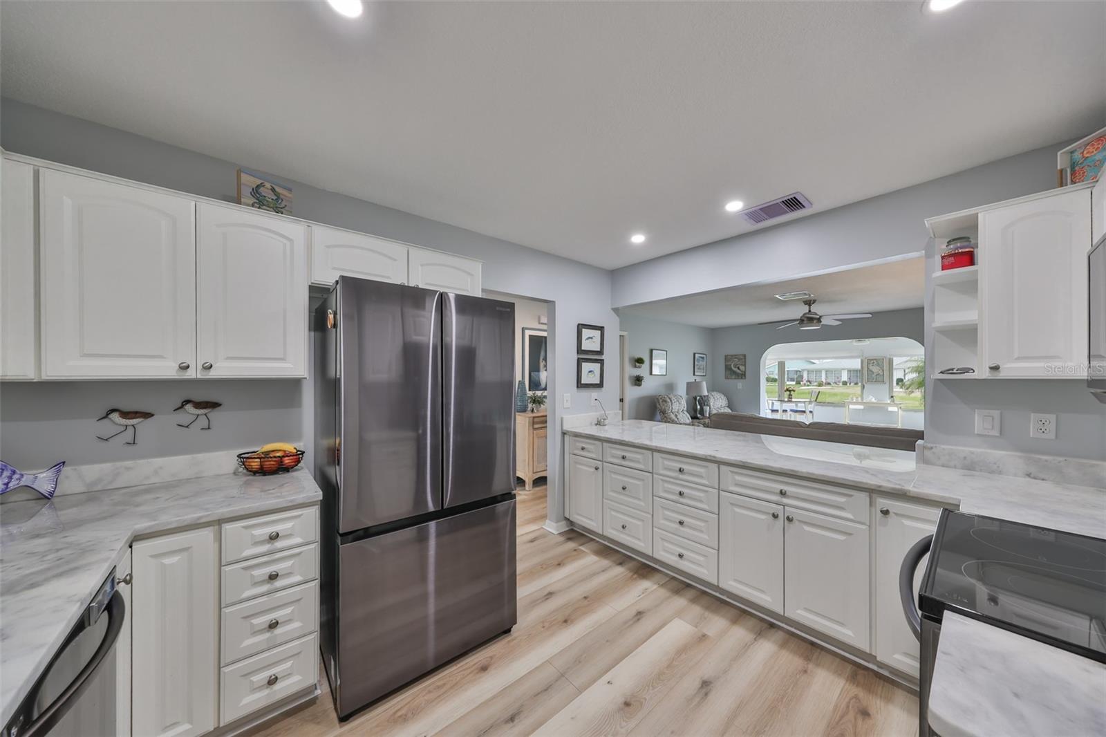 Modern, clean and bright this sparkling kitchen has lots of storage and all the features a cook could want.