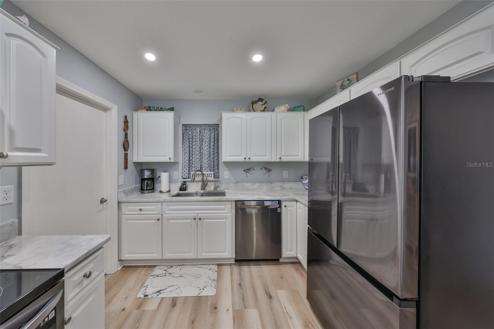 Notice the flooring continues right into the kitchen, as it does throughout the rest of the home.