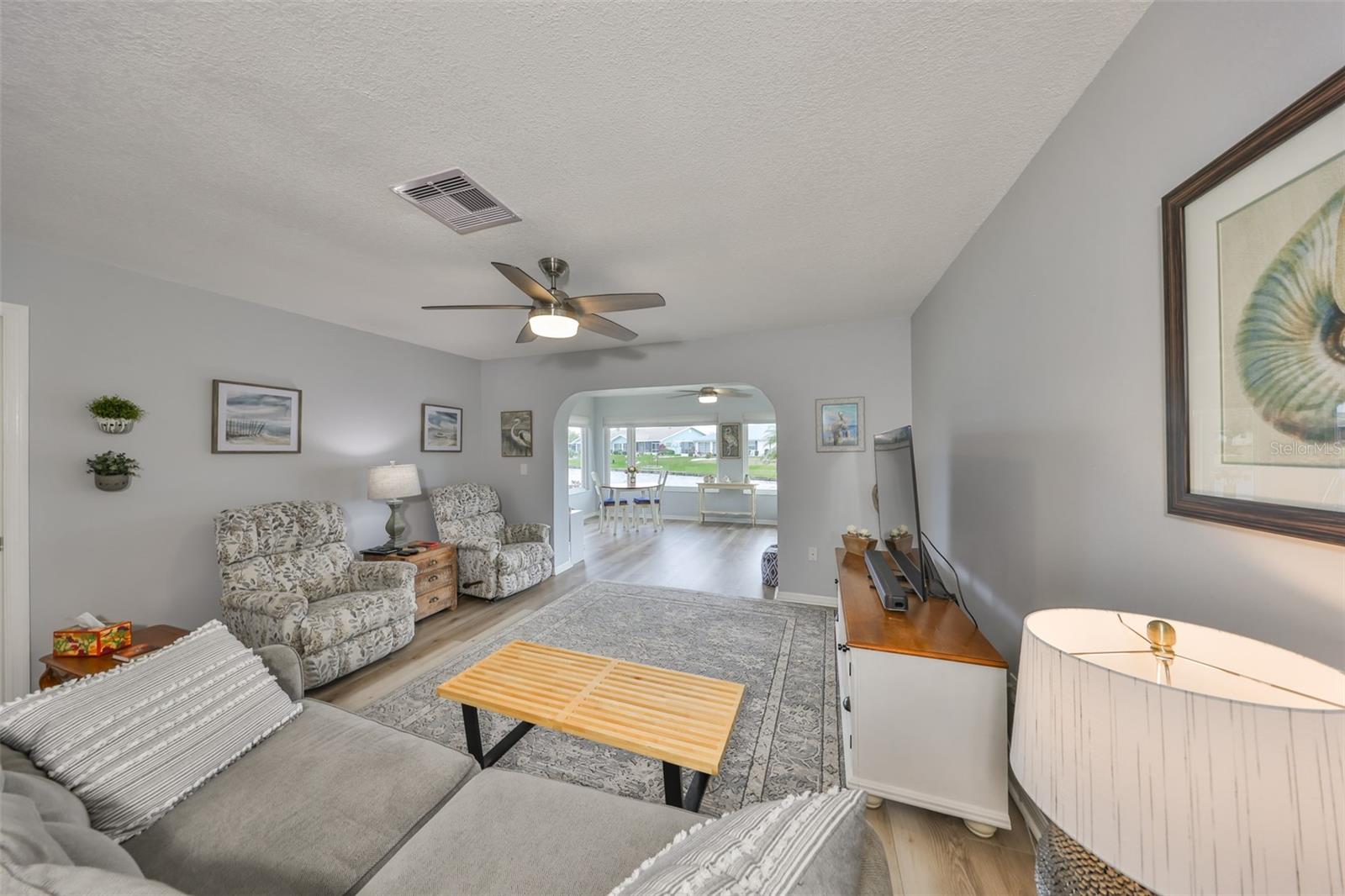 The family room continues the open space feel, with a view of the lake.