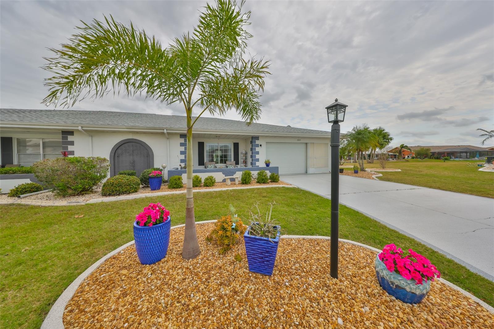 The landscape is simple and well manicured.  Notice the distance between the houses.