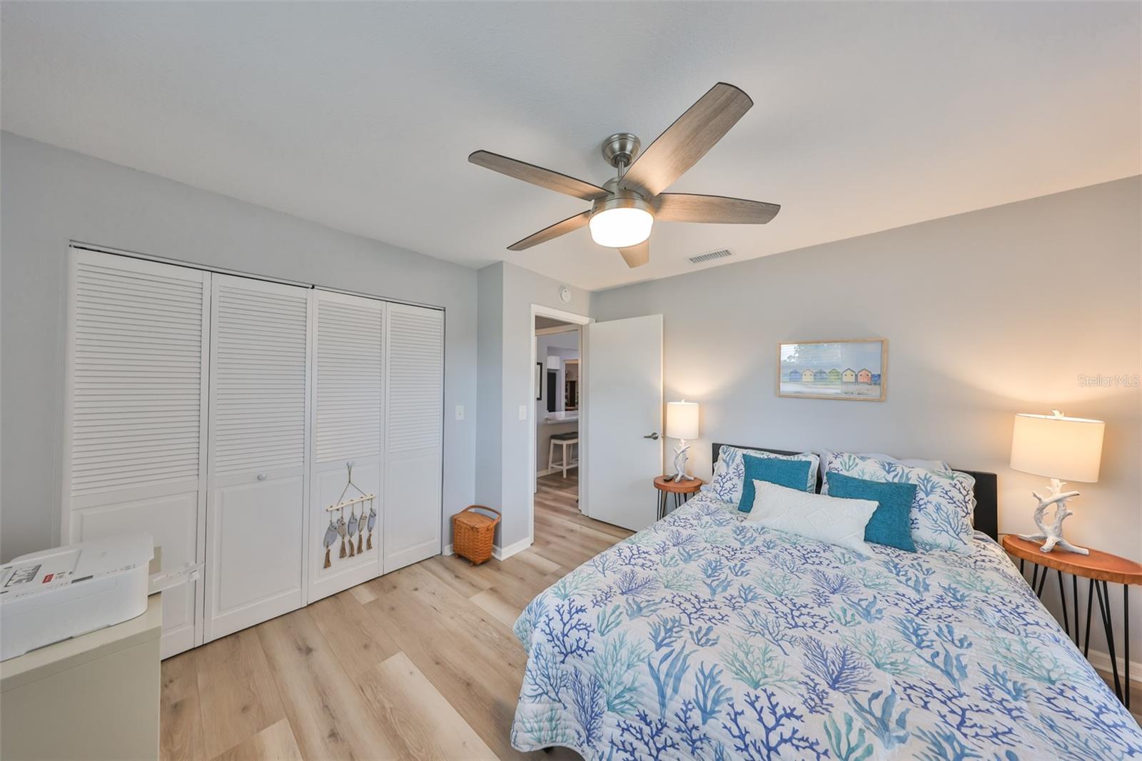 A large double wall closet and a bathroom directly next to the bedroom.