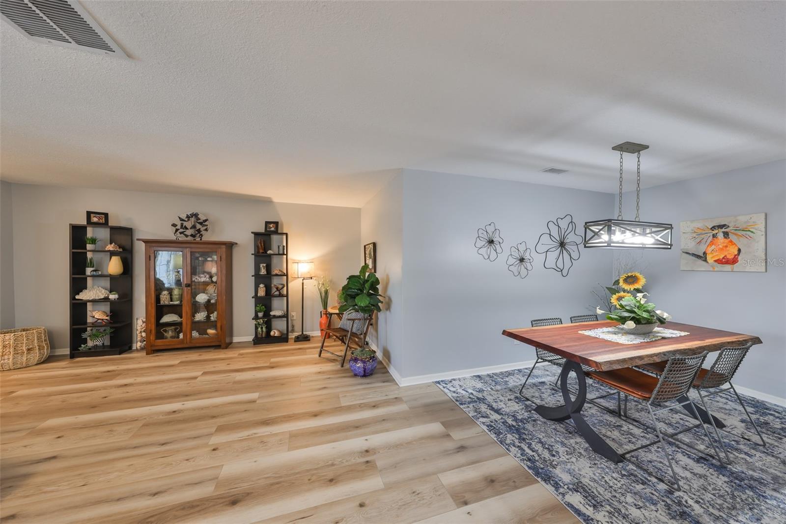 While this is an open floor plan, there is just enough identification of space to offer separation of the rooms. Again new light fixtures and NO popcorn ceiling.