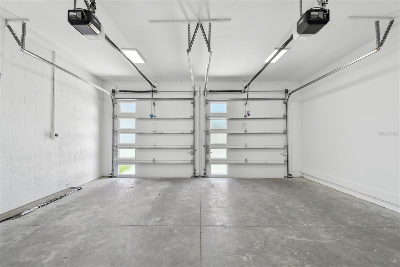 Insulated garage door & electric car outlet for charging station