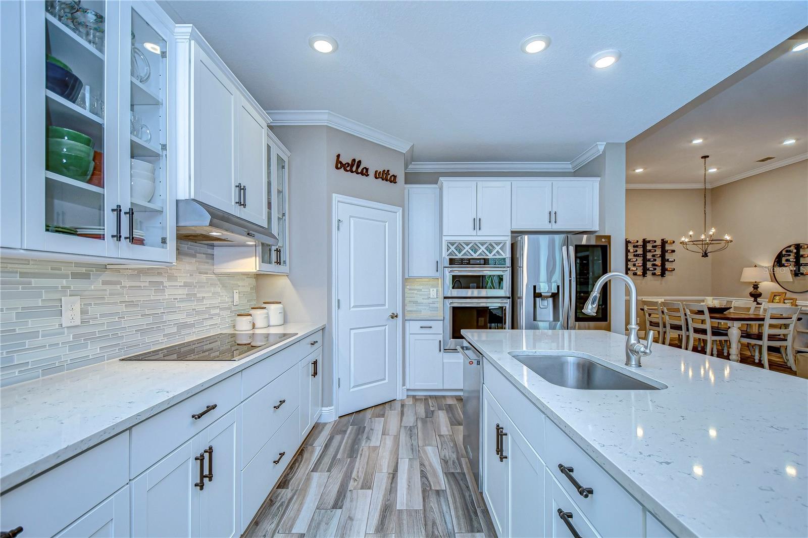 Discover a gourmet oasis in this elegantly modern kitchen.