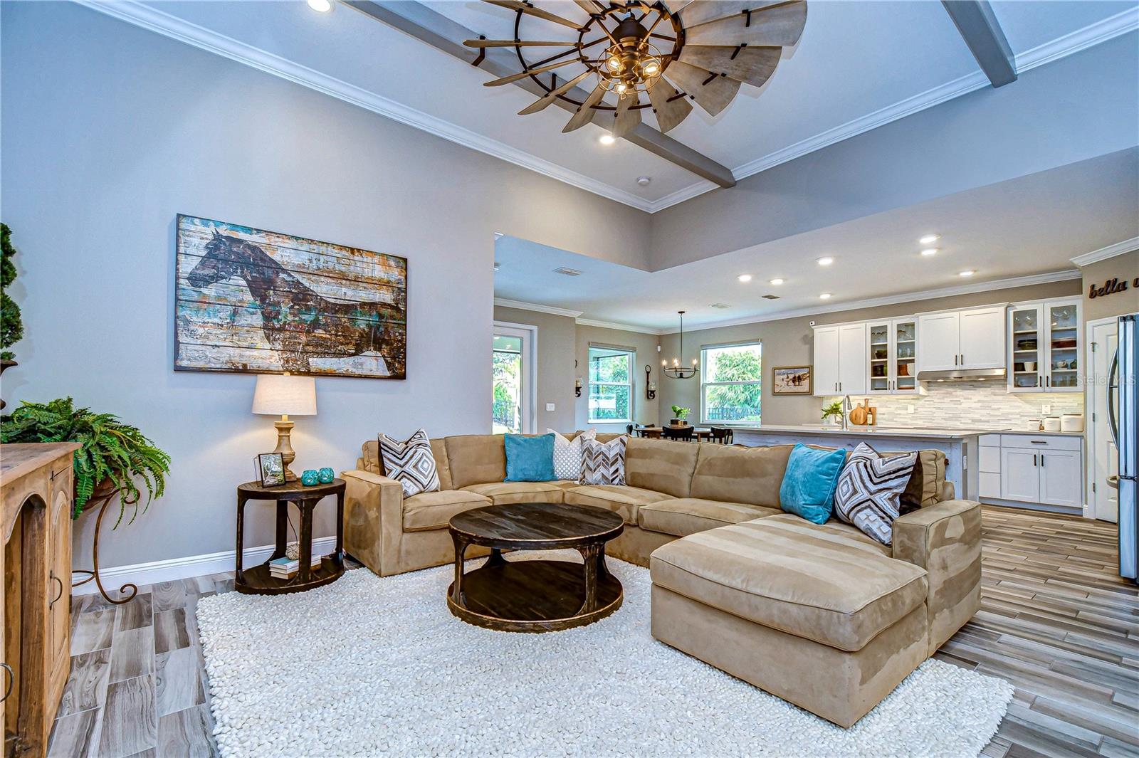 Embrace the harmony of modern elegance and cozy charm in this exquisite living space.