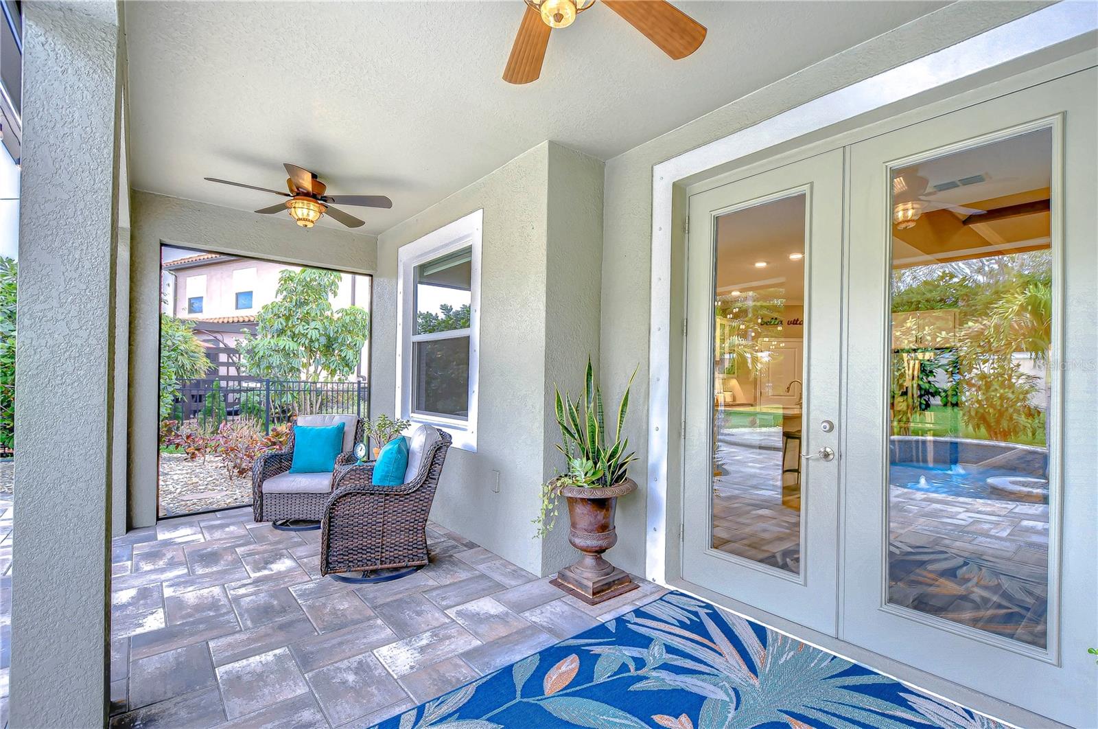 Step into tranquility on this charming lanai.