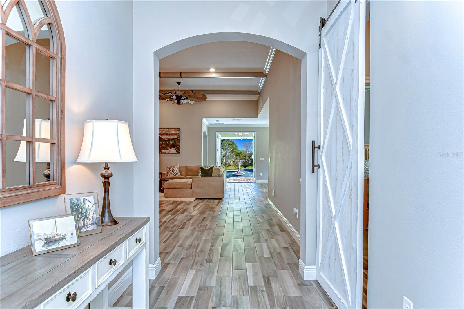 lide through the entryway, leading you to a sunlit living space.