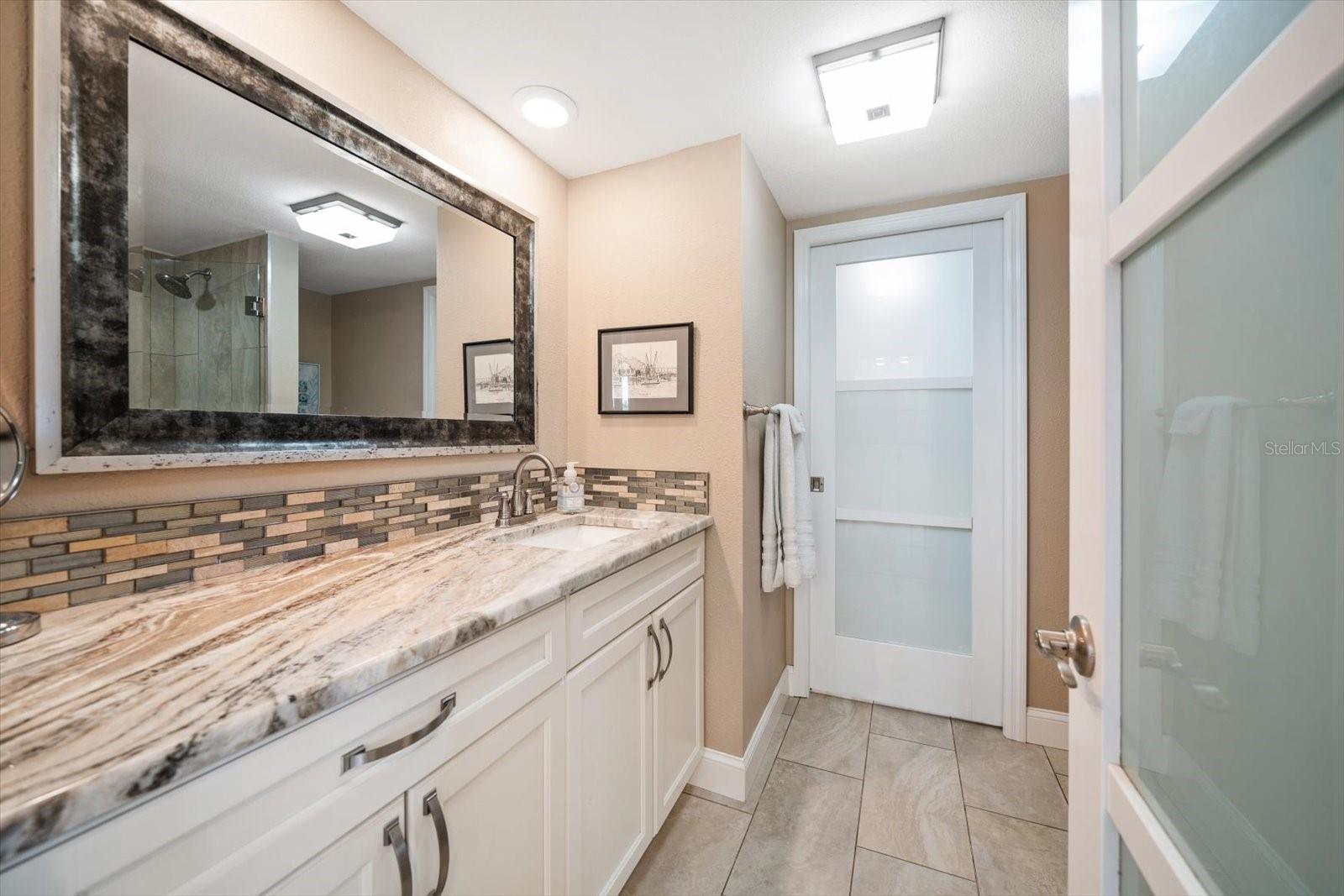 Love this guest bathroom- contemporary finishes are attractive!!