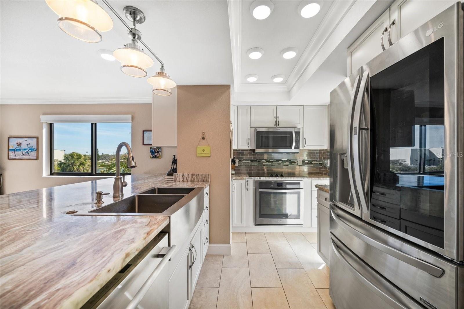 Love cooking up some FUN in this beautiful kitchen! Newer stainless appliances complement this area so rich in details and so functional for any chef!!