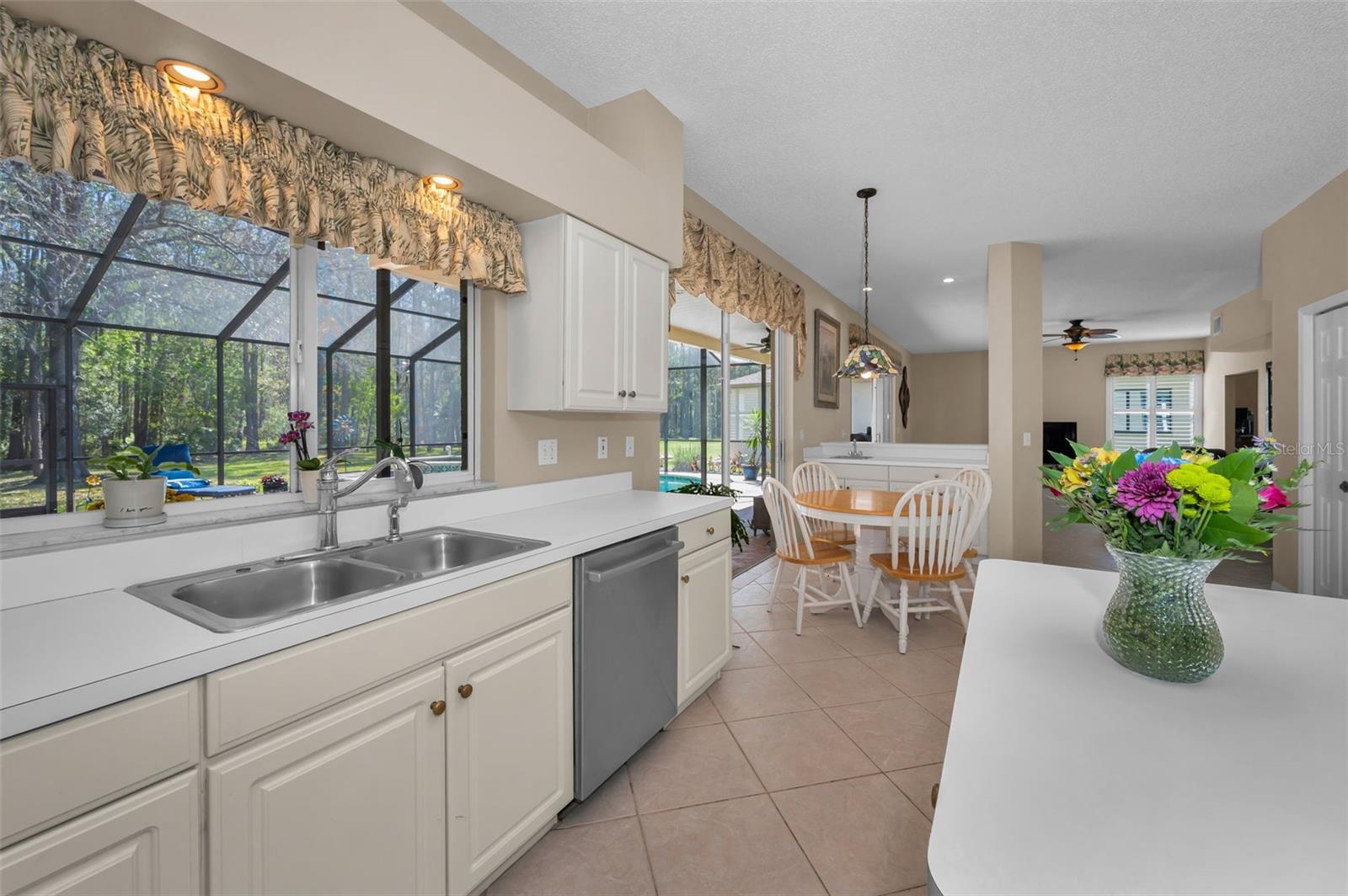 Kitchen into open floor plan to Family Room