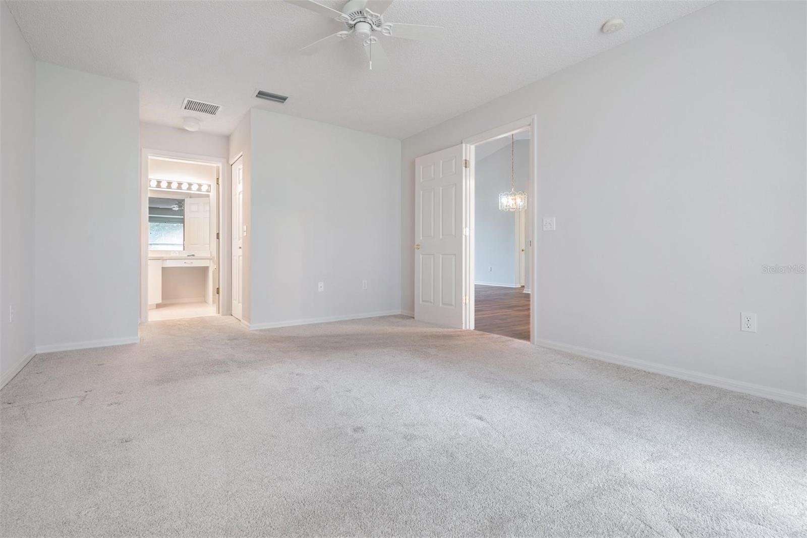 Master bedroom view of living room and bathroom