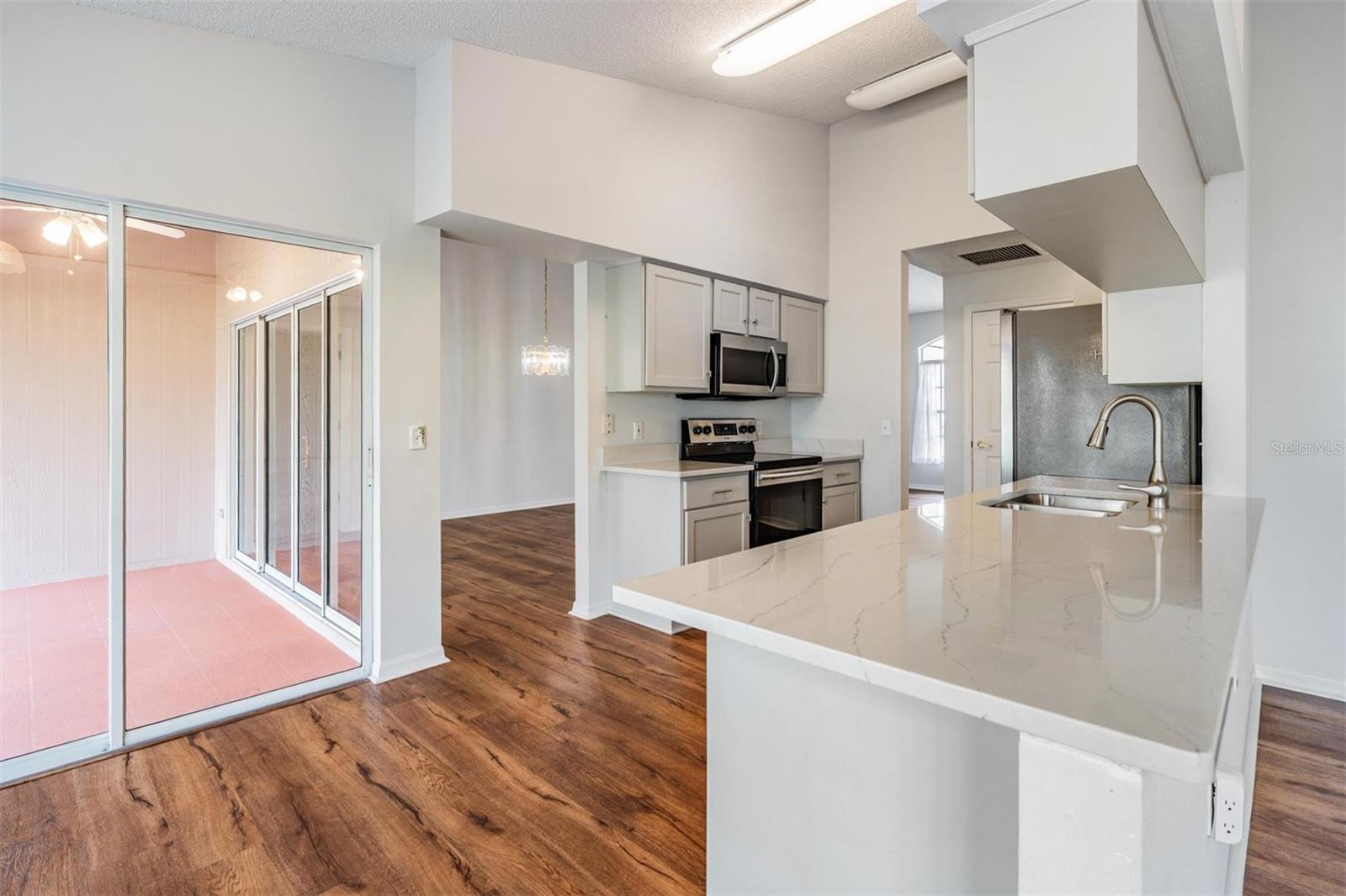 Thoughtful floorplan with patio view from the kitchen and living room