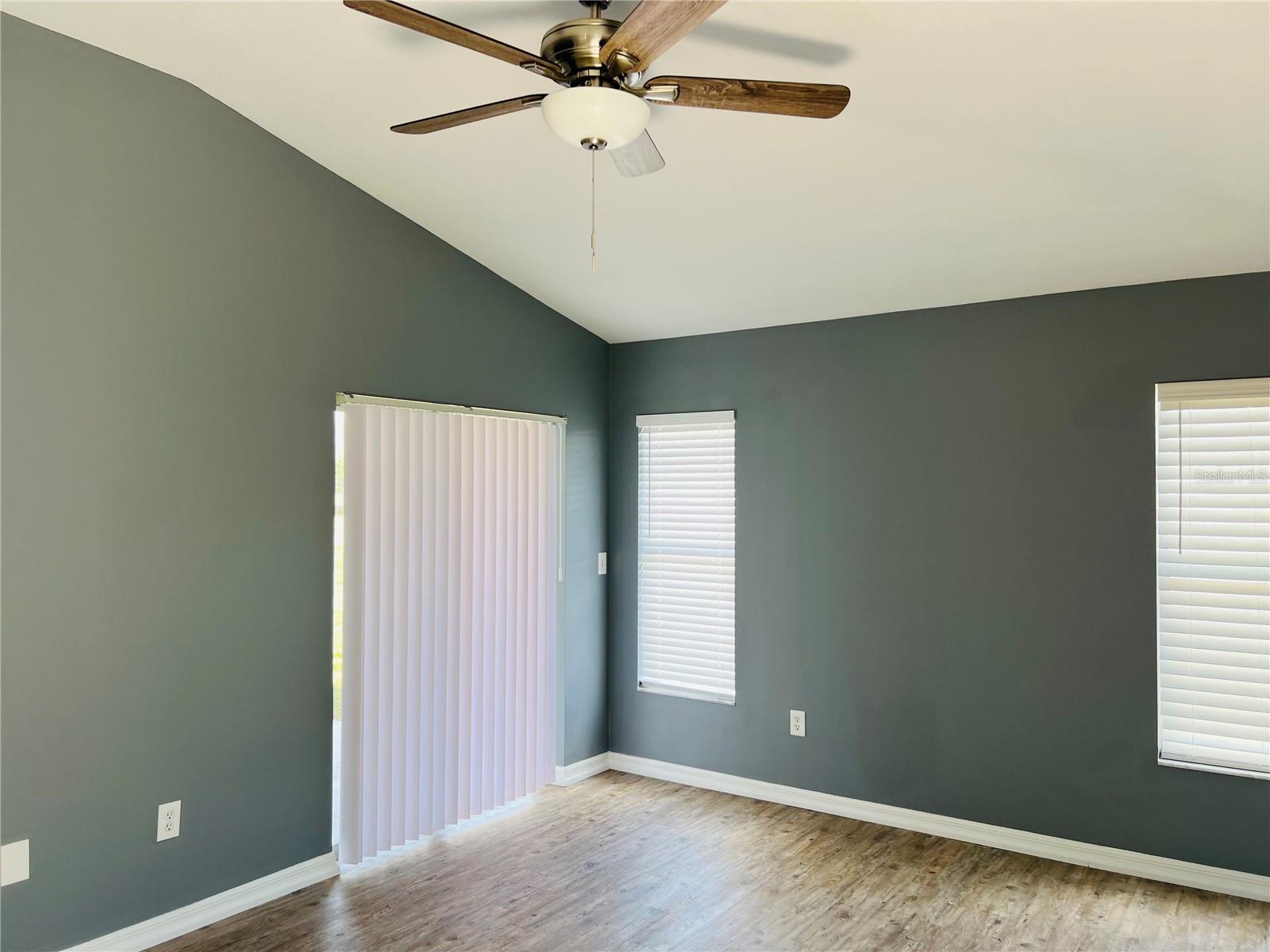 Primary bedroom, with patio door