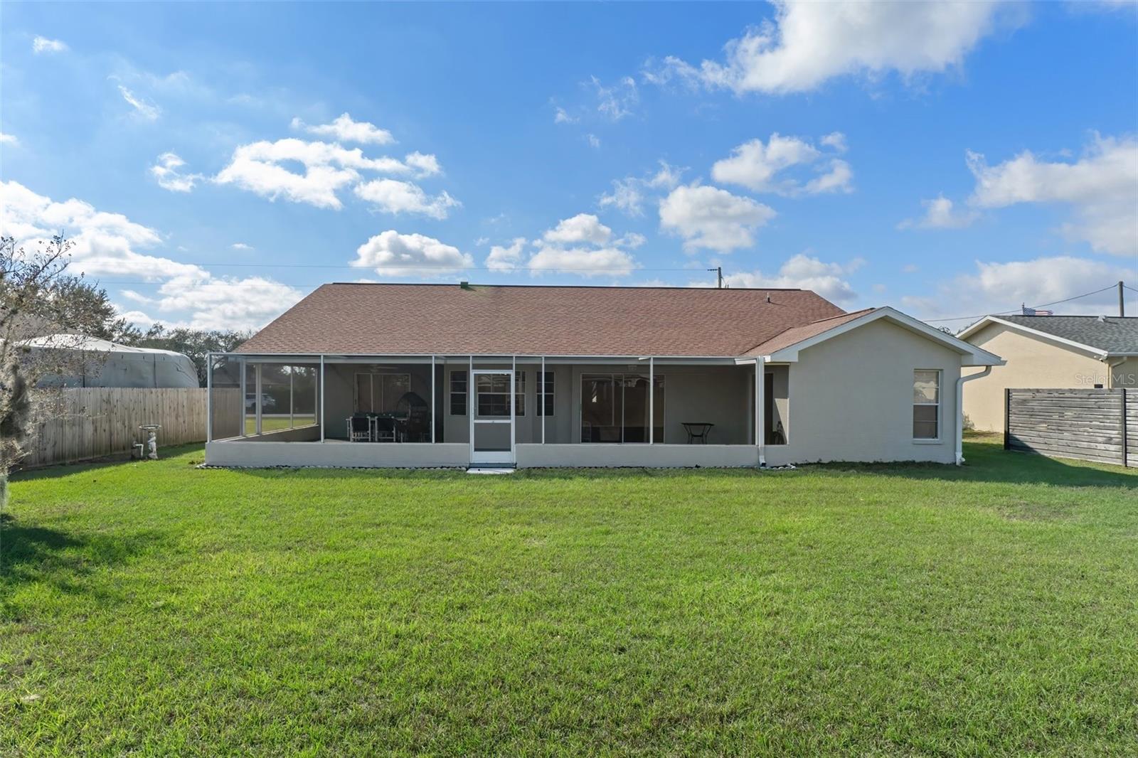 Rear of Home with Spacious Backyard