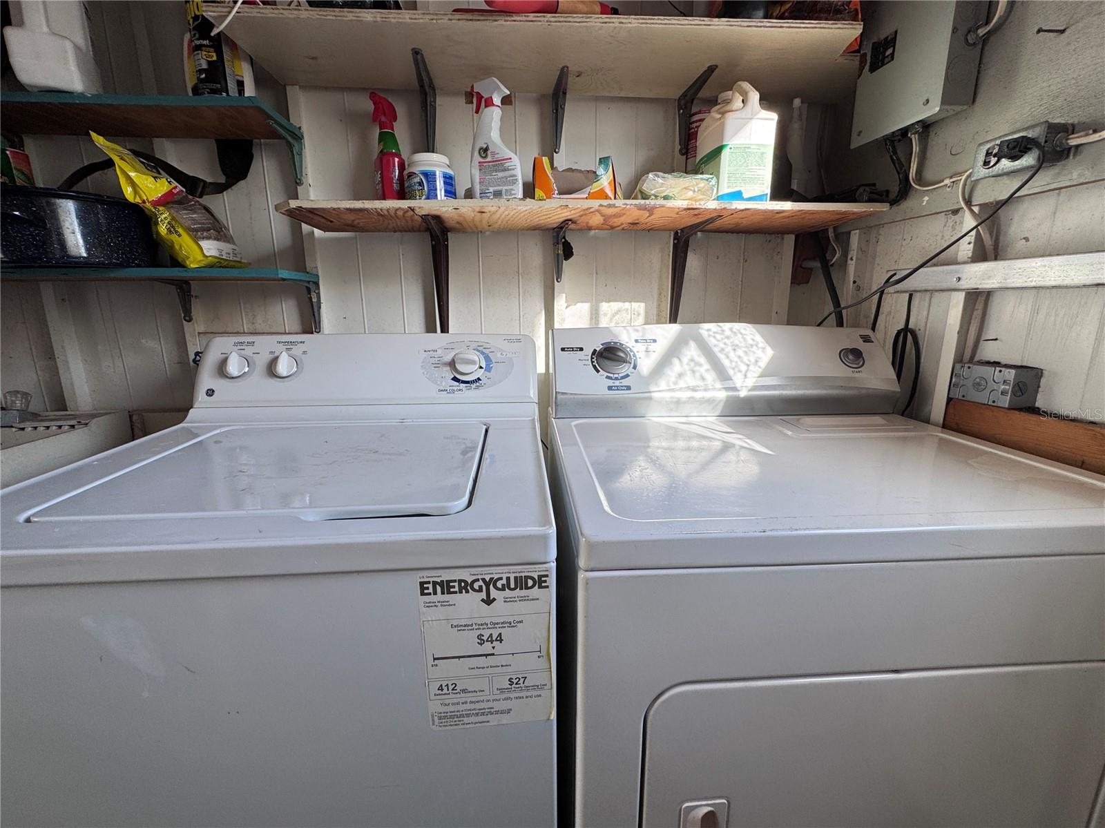 Laundry located in the shed off the carport.