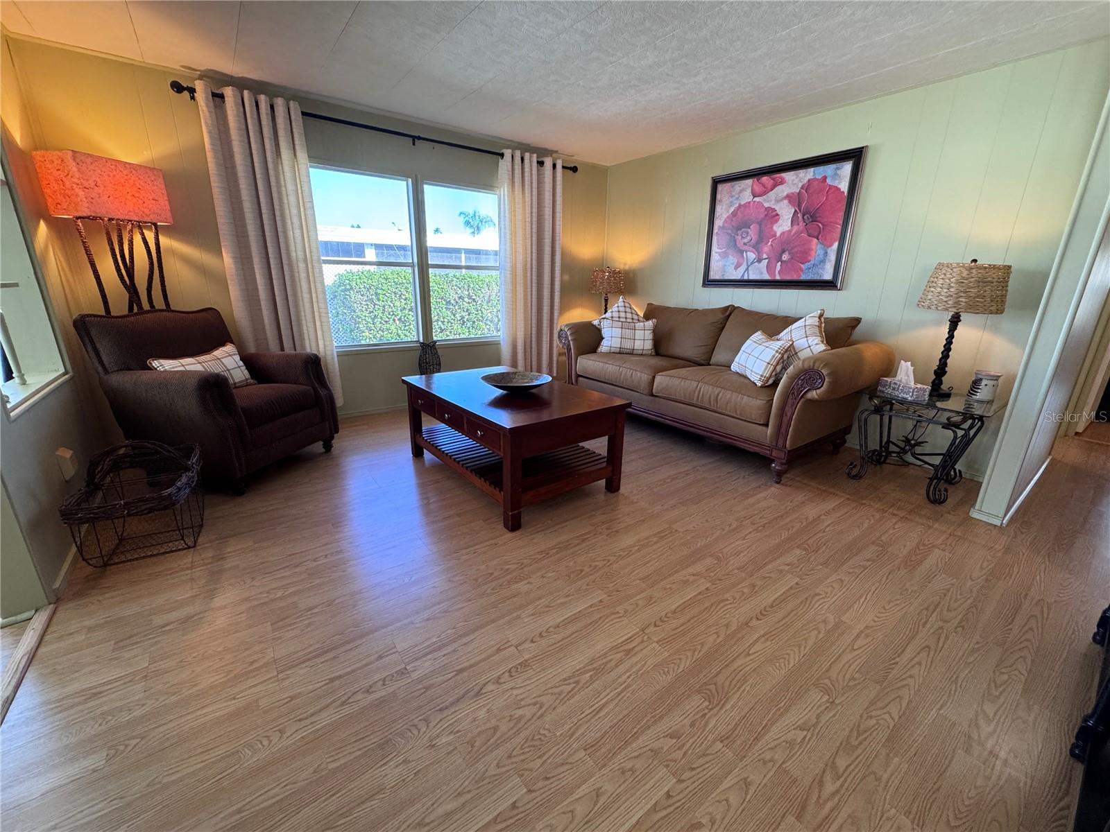 Open living room with laminate flooring.