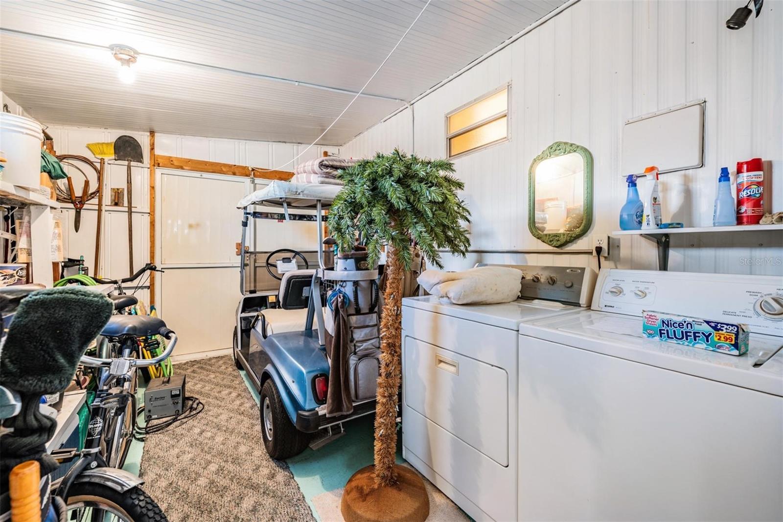 Laundry and golf cart storage.