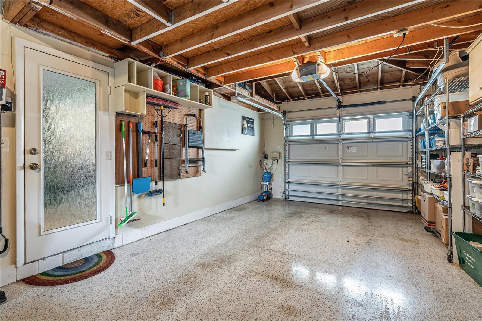 Oversized 1 car garage with terrazzo flooring