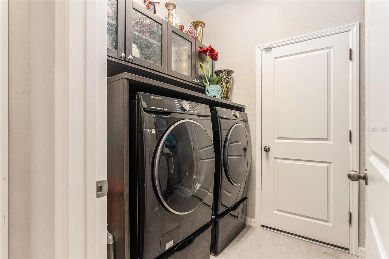 --  Laundry Room w/ Custom Cabinets and Additional Storage (Not Pictured). Washer and Dryer Included!  --