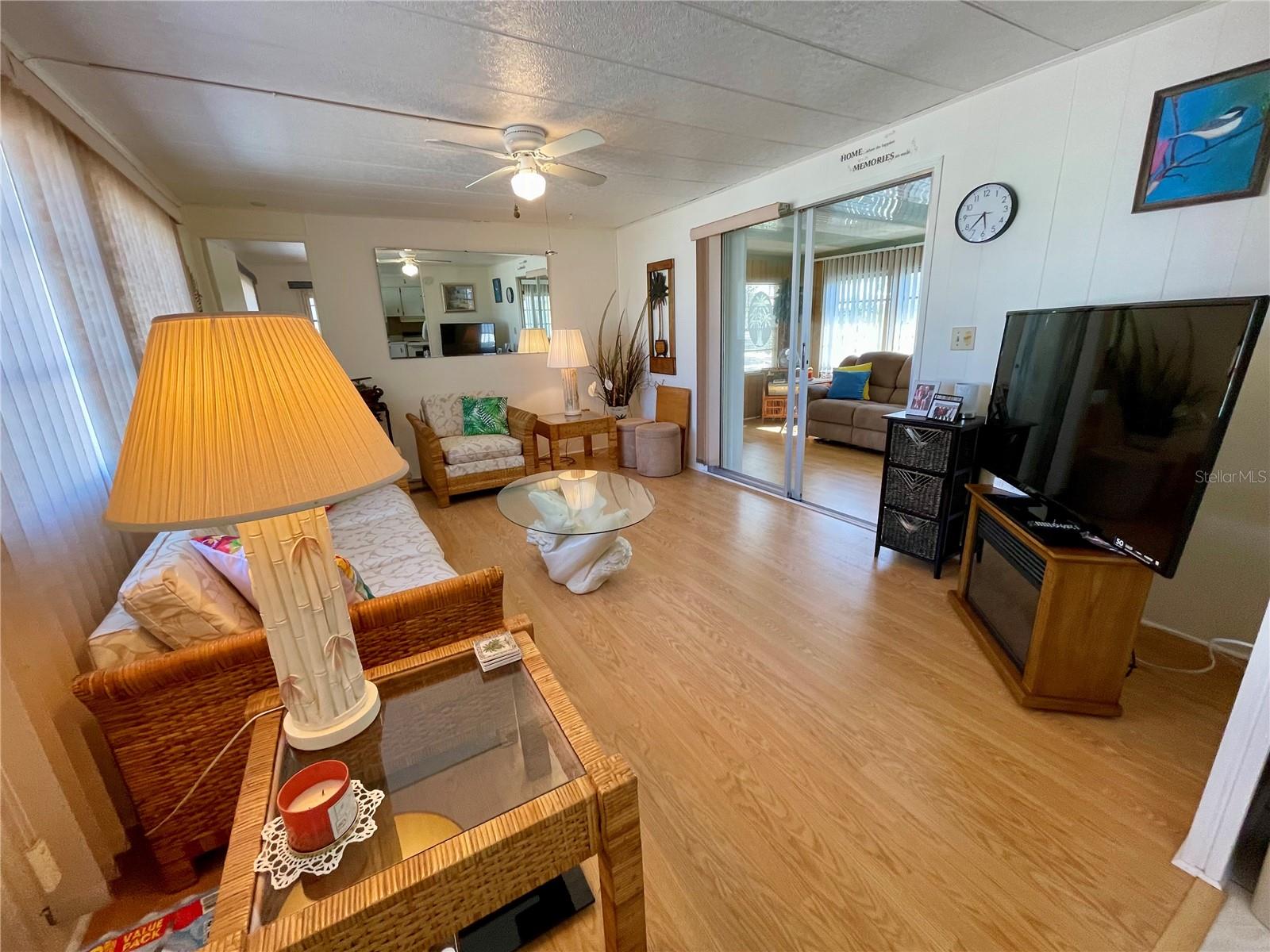 Living room, 2nd bedroom is behind open door at top left of picture… Florida room through sliding doors (this is not included in the heated square footage.