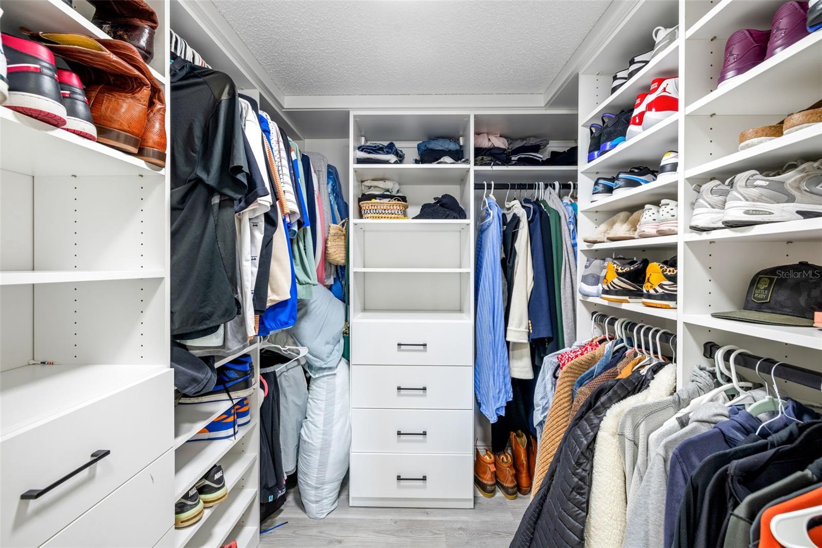 Primary bedroom walk-in closet