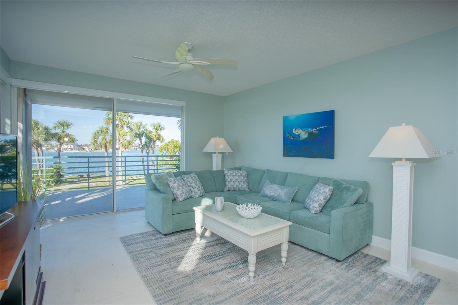 Spacious Living Room Overlooks Extended Rear Balcony