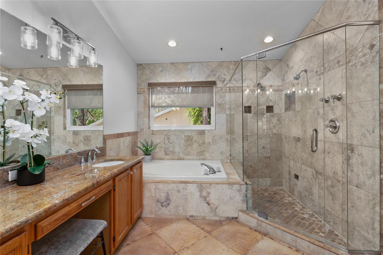 Primary Bathroom with large tub and walk in shower