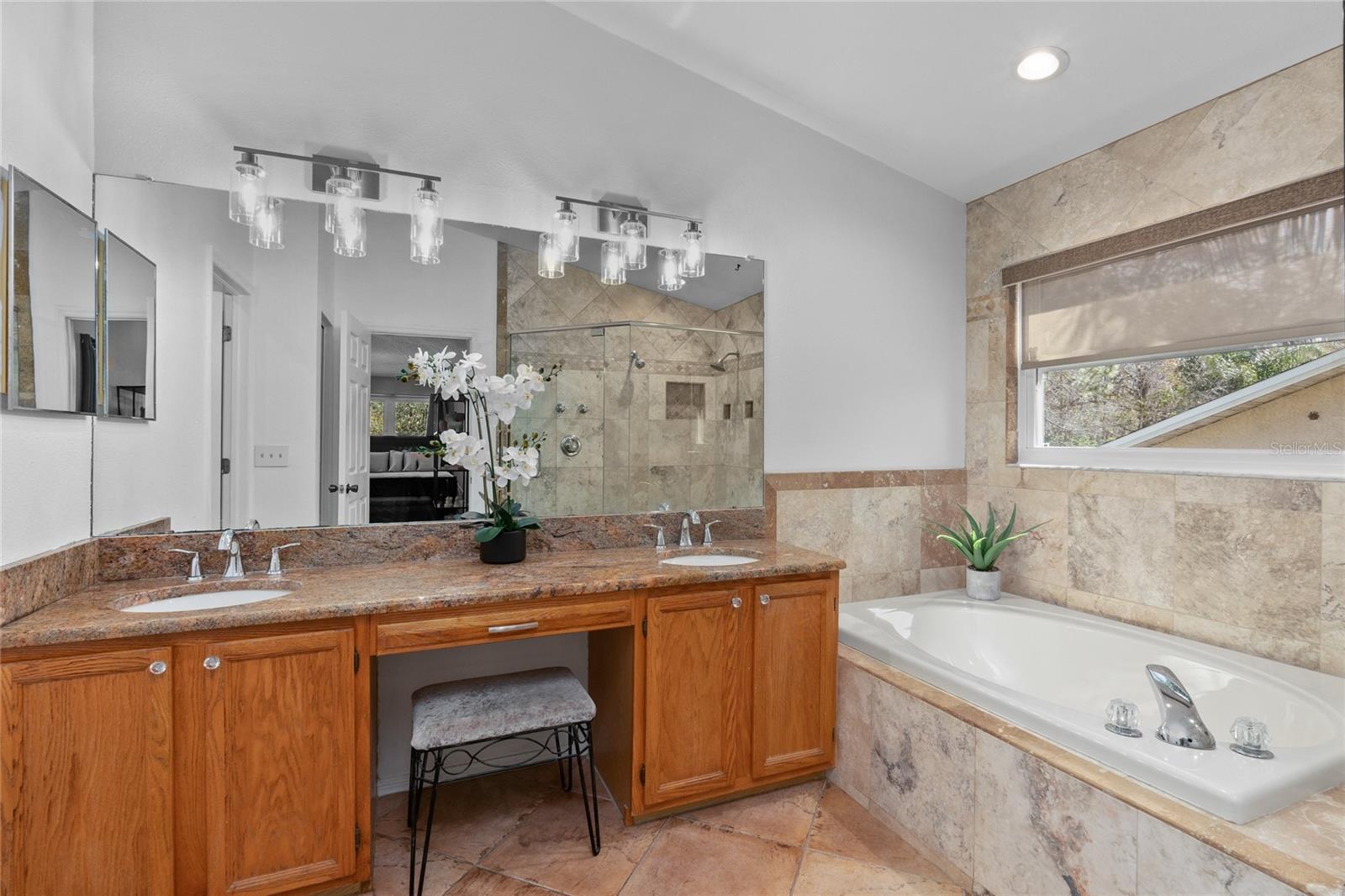 Dual sinks in Primary Bathroom with granite sinks