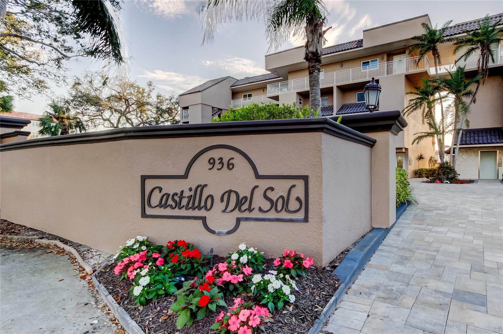 Welcome to Castillo Del Sol! The beautifully landscaped entrance invites you into this charming waterfront community. Unit T-7, the end unit straight ahead in the southern building, offers a prime location for coastal living.