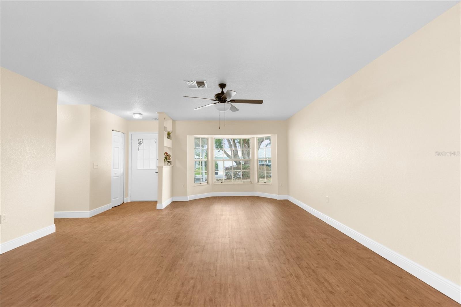 Formal living room with large windows looking out to the front porch!