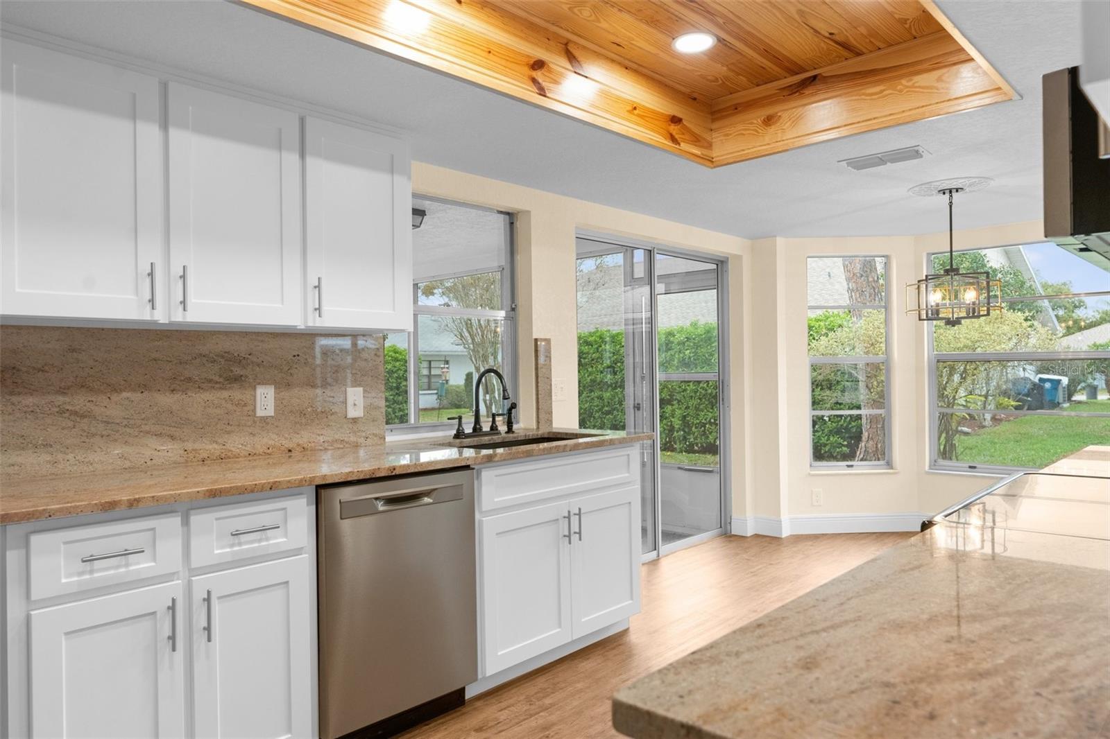 New white kitchen cabinets and granite countertops and granite wall backsplash!!