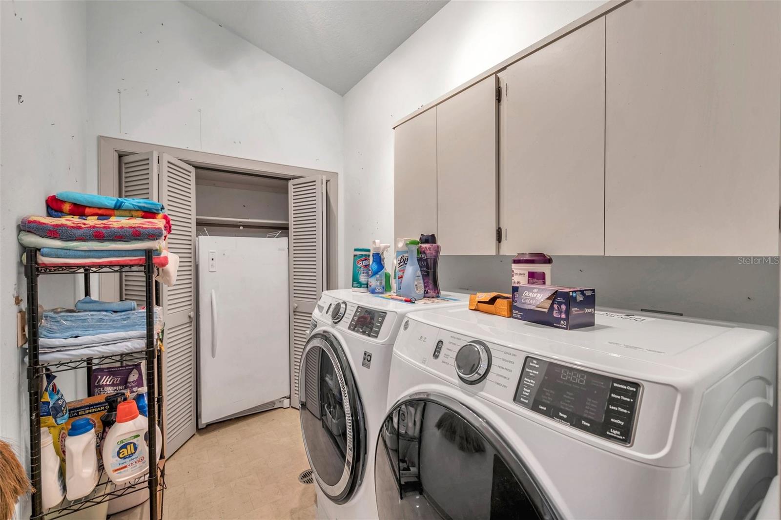 Inside Utility Room with Full Size Freezer