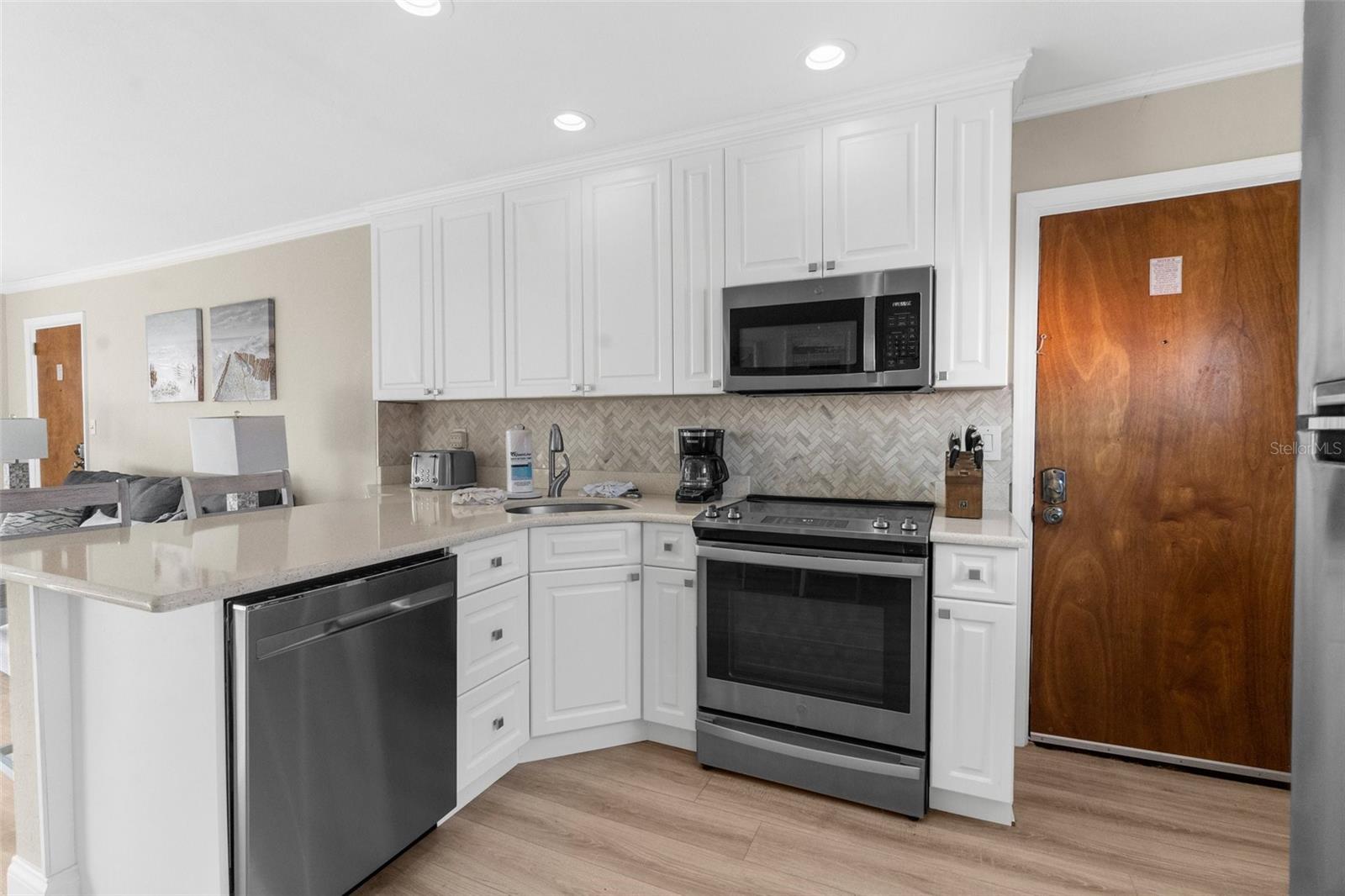 Updated kitchen with open floor plan overlooking living room and views to the Gulf.