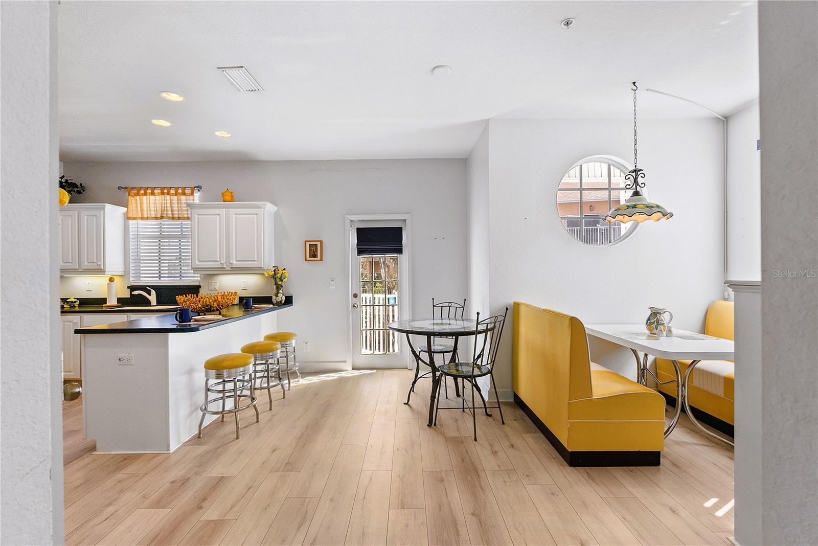 Large kitchen with booth and breakfast bar