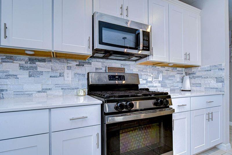 View of upgraded stone backsplash