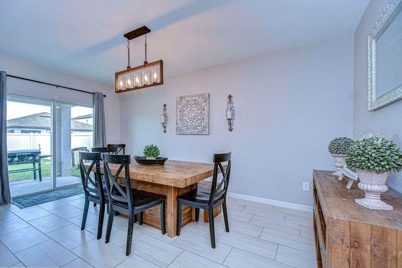 Dining room with sliding doors to your beautiful backyard.