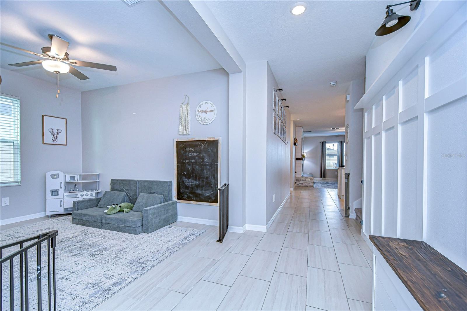 View from front door with accent wall and bench upgrade on the right