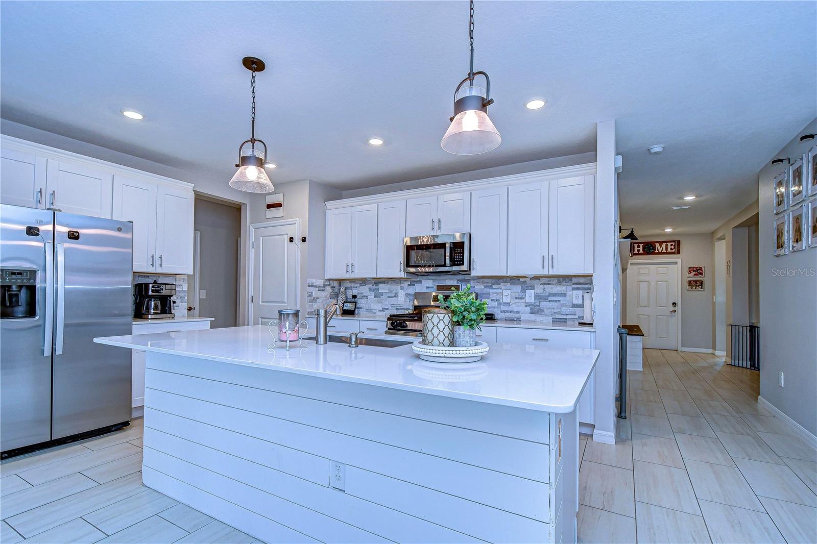 Kitchen with view down hallway.