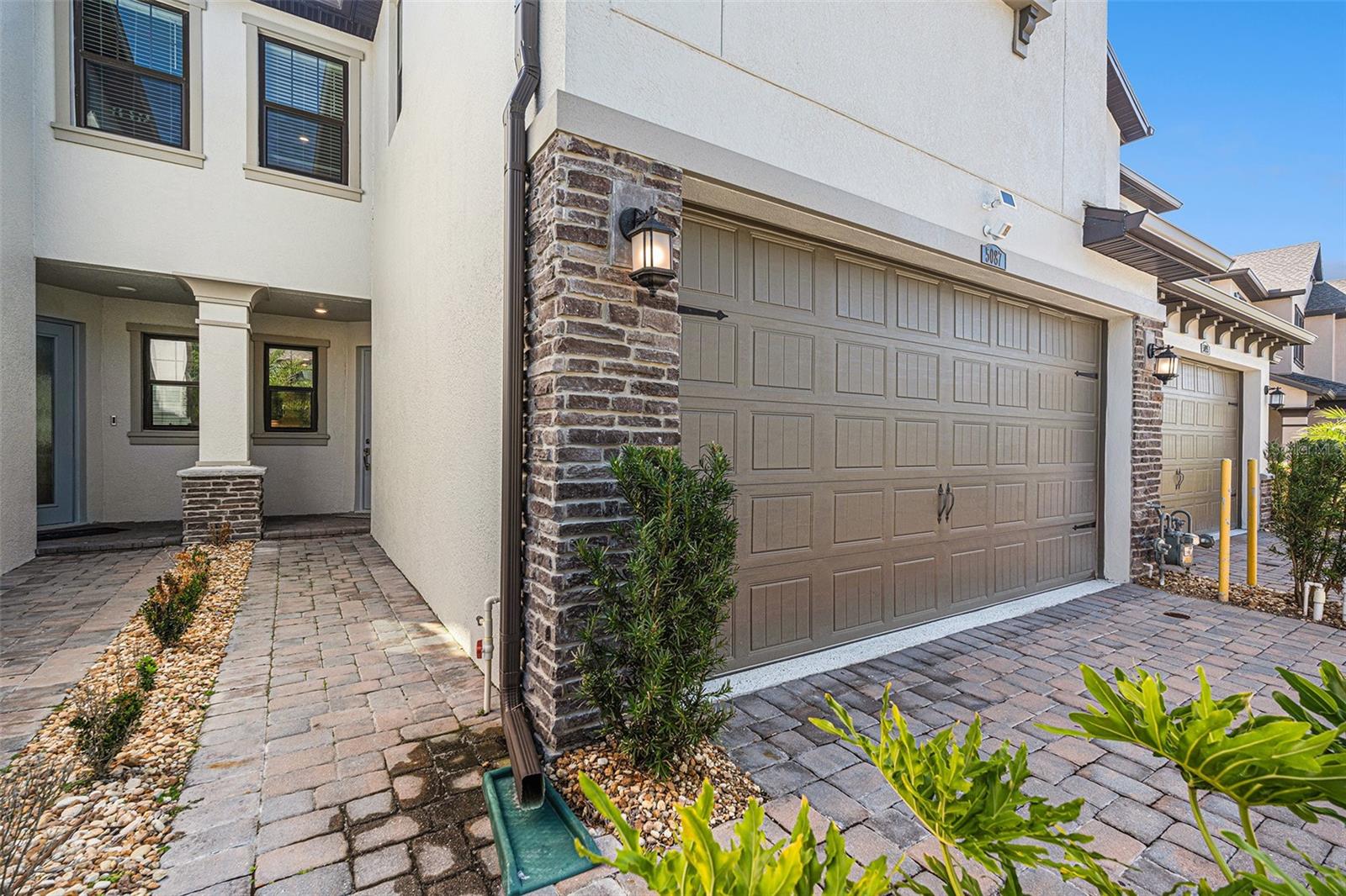 Two car garage with epoxy floor and storage room