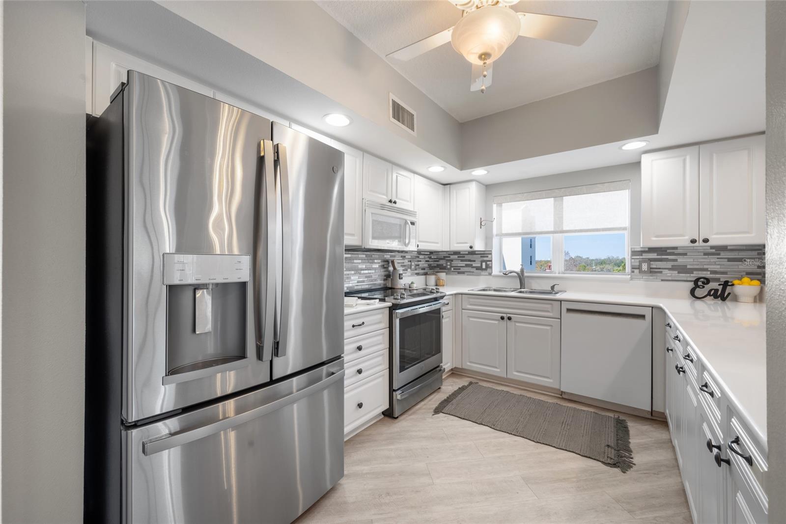 Sink Window, ample Cabinets, Quartz Counter