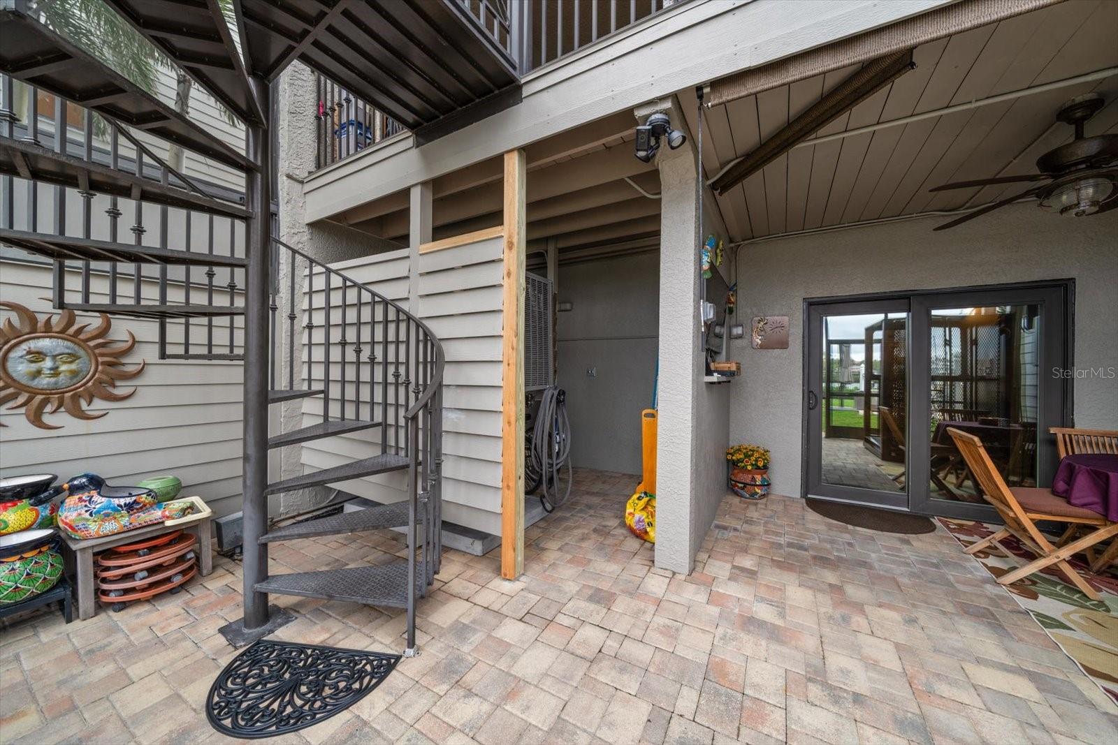 Ground floor lanai area with access to other floors by sprial metal staircase