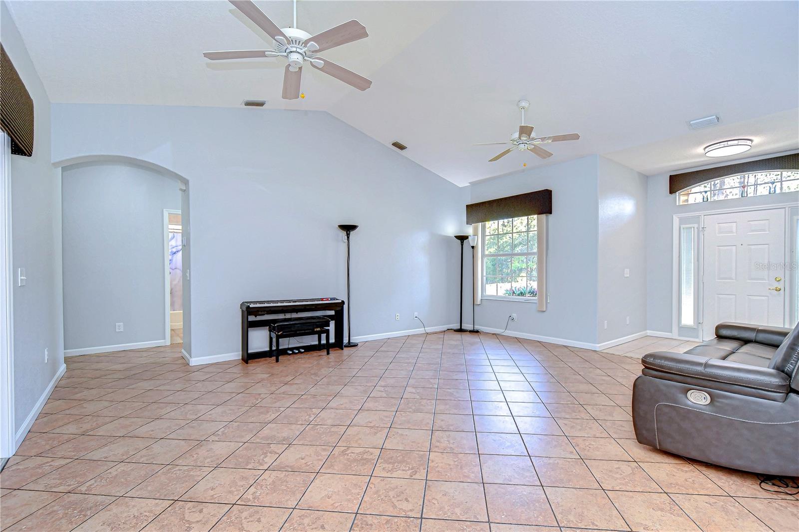 High ceilings and ample natural light make this the perfect space to relax or entertain.