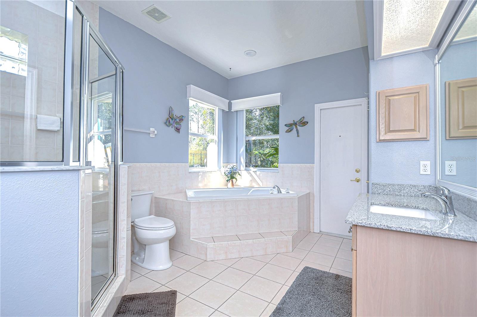 Step into serenity with this bright, spacious bathroom