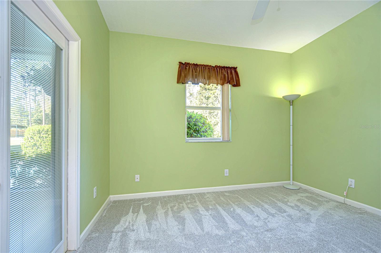 Step into tranquility with this sunlit third bedroom