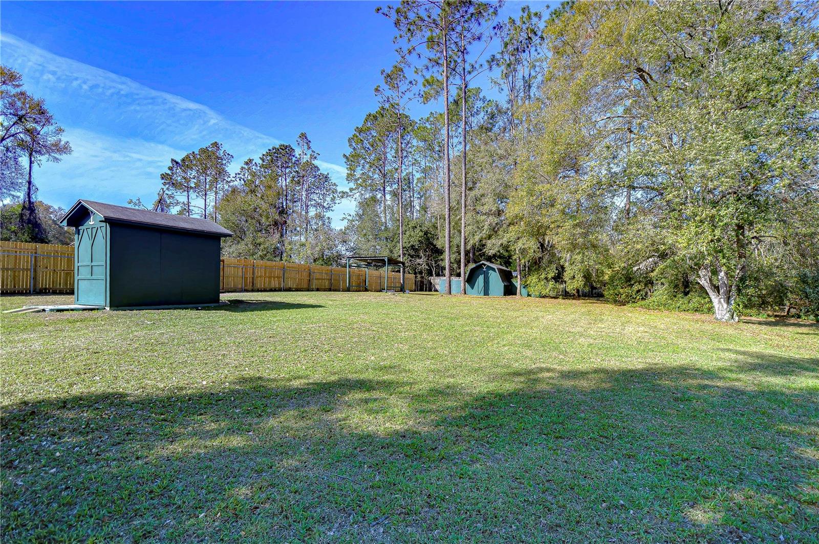 This expansive backyard is a canvas for your dreams—garden, playground, or weekend gatherings.