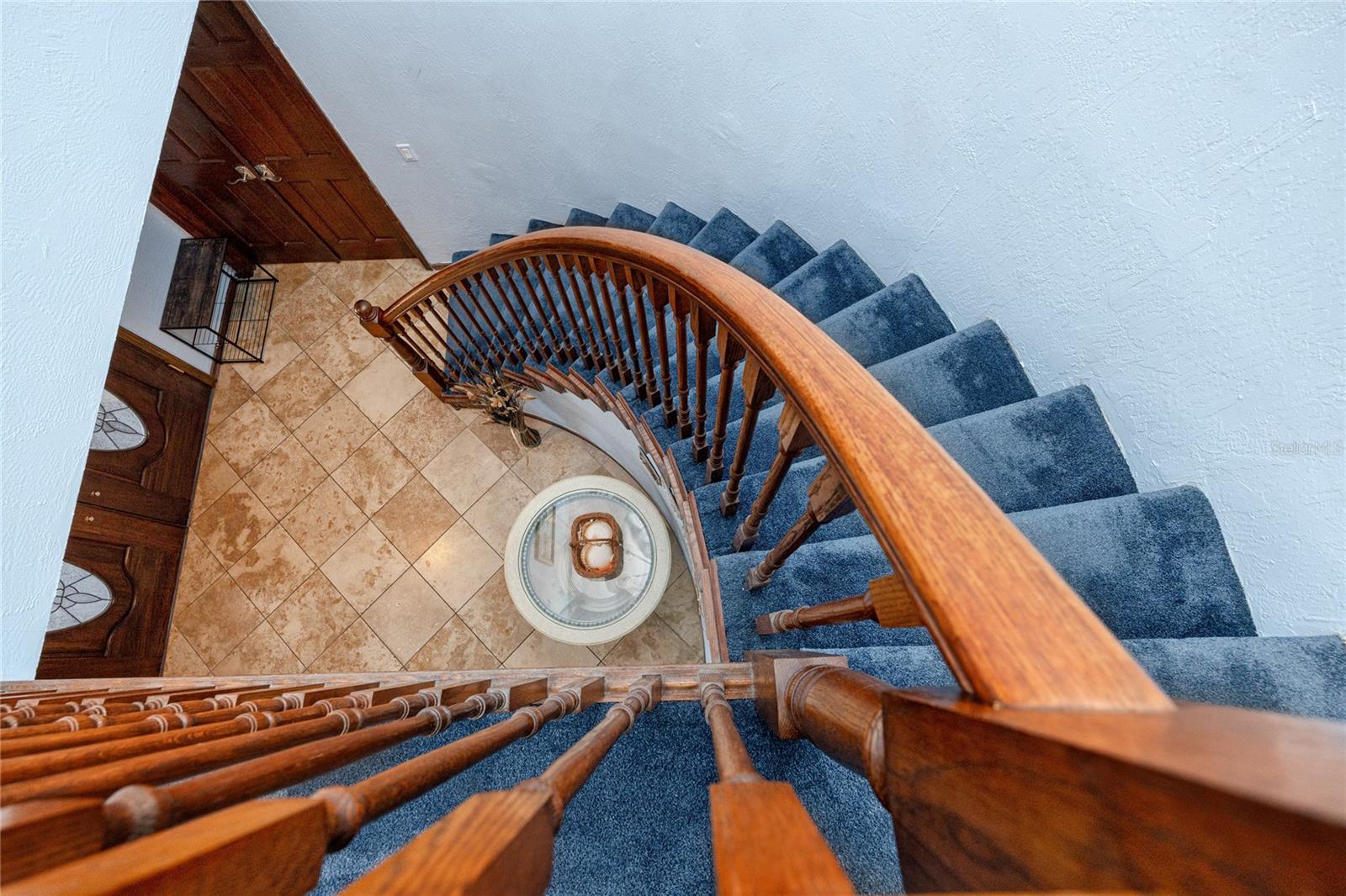 View from top of the stairs to the foyer