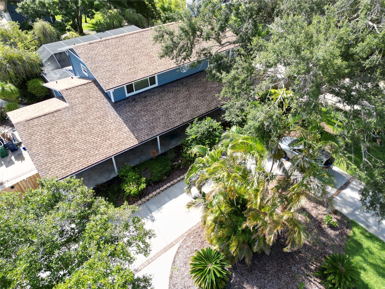 Aerial view of the house from the front in the summer