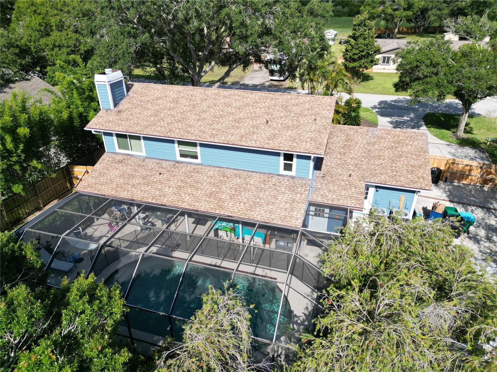 Aerial view of the main house from the back in the summer